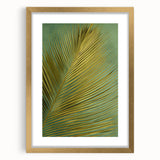 Framed wall art featuring a vibrant floral design with gold matting and decorative leaves, ideal for home decor or as a thoughtful gift. Perfect for adding elegance to living spaces.