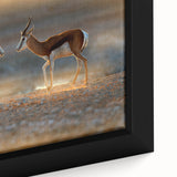 Extra large framed canvas featuring a textured depiction of an African scenery in black with colorful accents.
