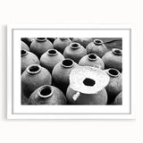 Abstract art print of a Laos scenery in soft blue and green tones on a white framed mat, ideal for dining room decor.