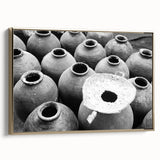 Framed canvas depicting a serene Laos landscape in muted gold and black tones, suitable as wall art for a bedroom.