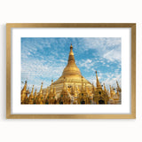 Extra large abstract art print of a textured Myanmar scenery in muted gold and brown tones, framed with a mat.