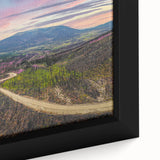 Black wall art featuring a textured Yukon scenery on a framed canvas, with vibrant colors, ideal for living room decor.