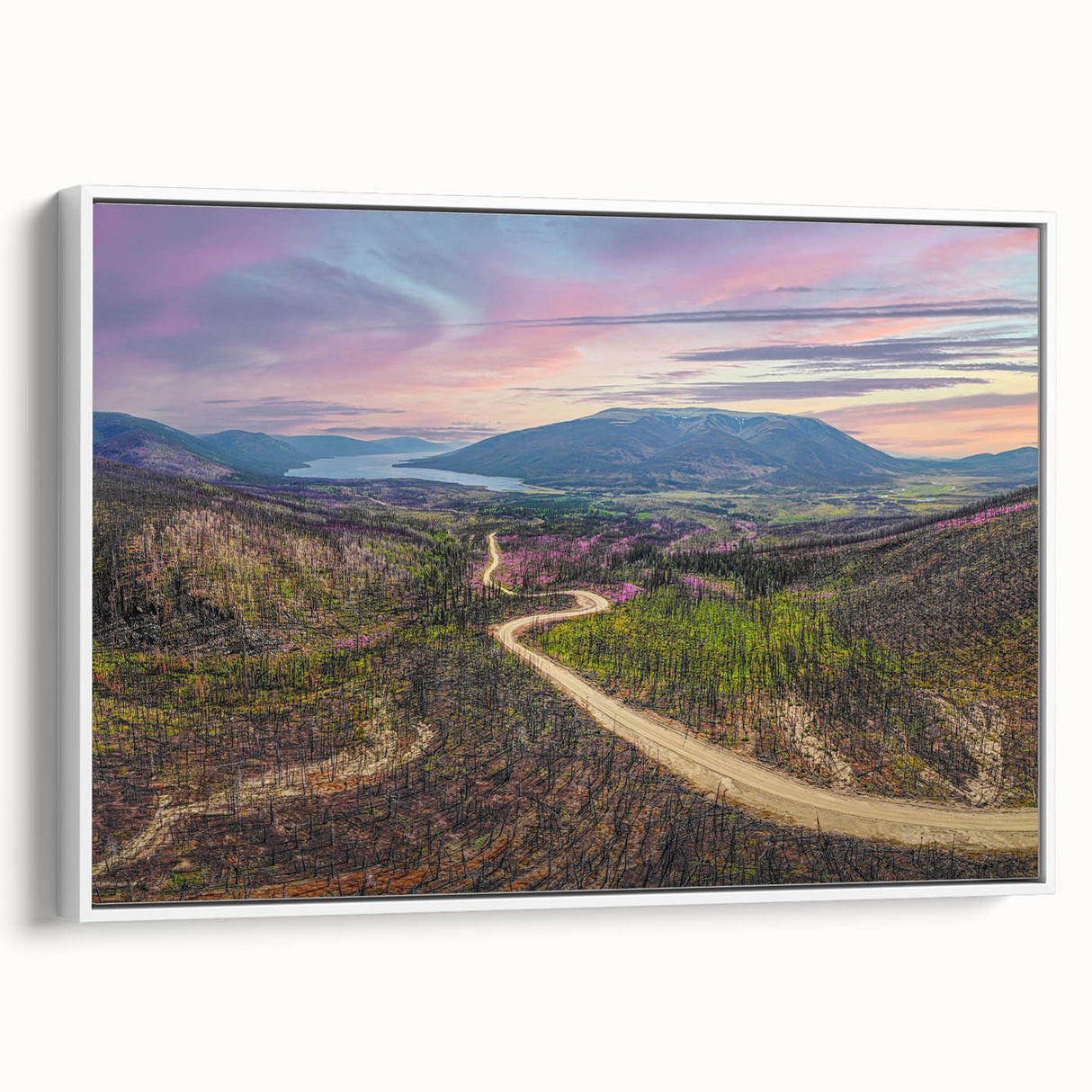 Vintage poster art of a Yukon scenery on framed canvas, featuring colorful art with black borders.