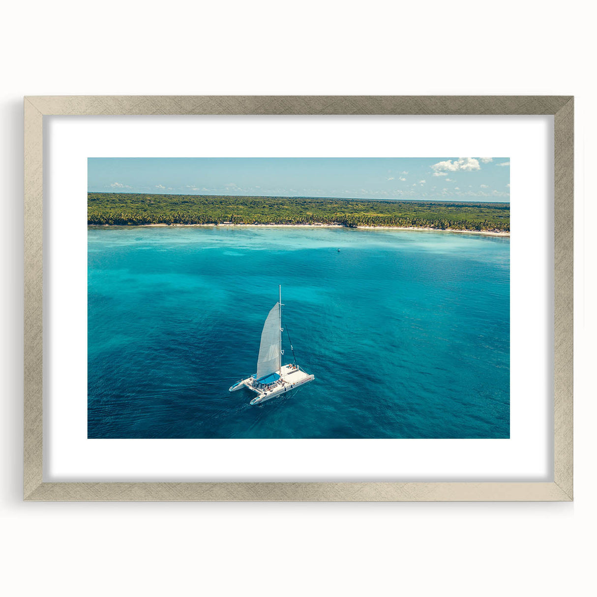 Extra large abstract art print featuring textured scenery of the Caribbean in muted blue and green tones, framed in silver.