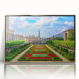 Large art print of a serene Belgian landscape in muted green and blue tones, framed in silver acrylic.