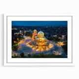 Textured abstract art print depicting a European scenery in muted earth tones, framed with a white mat.