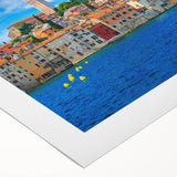 Art deco poster of a Croatian coastal scene on rolled canvas, featuring muted blues and beiges.