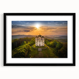 Abstract art print of a colorful European cityscape, in a black frame with mat, ideal for living room decor.