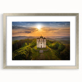 Extra large abstract art print of a textured European cityscape in muted earth tones, framed in silver.