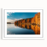 Textured art depicting an abstract Finnish landscape in muted earth tones, presented in a white framed print.