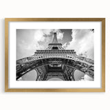 Abstract art print of Paris scenery in muted gold and blue tones on a framed canvas, suited for dining room decor.