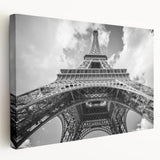 Large art depicting a Paris street scene in muted gray and blue tones on stretched canvas, ideal for kitchen wall art.