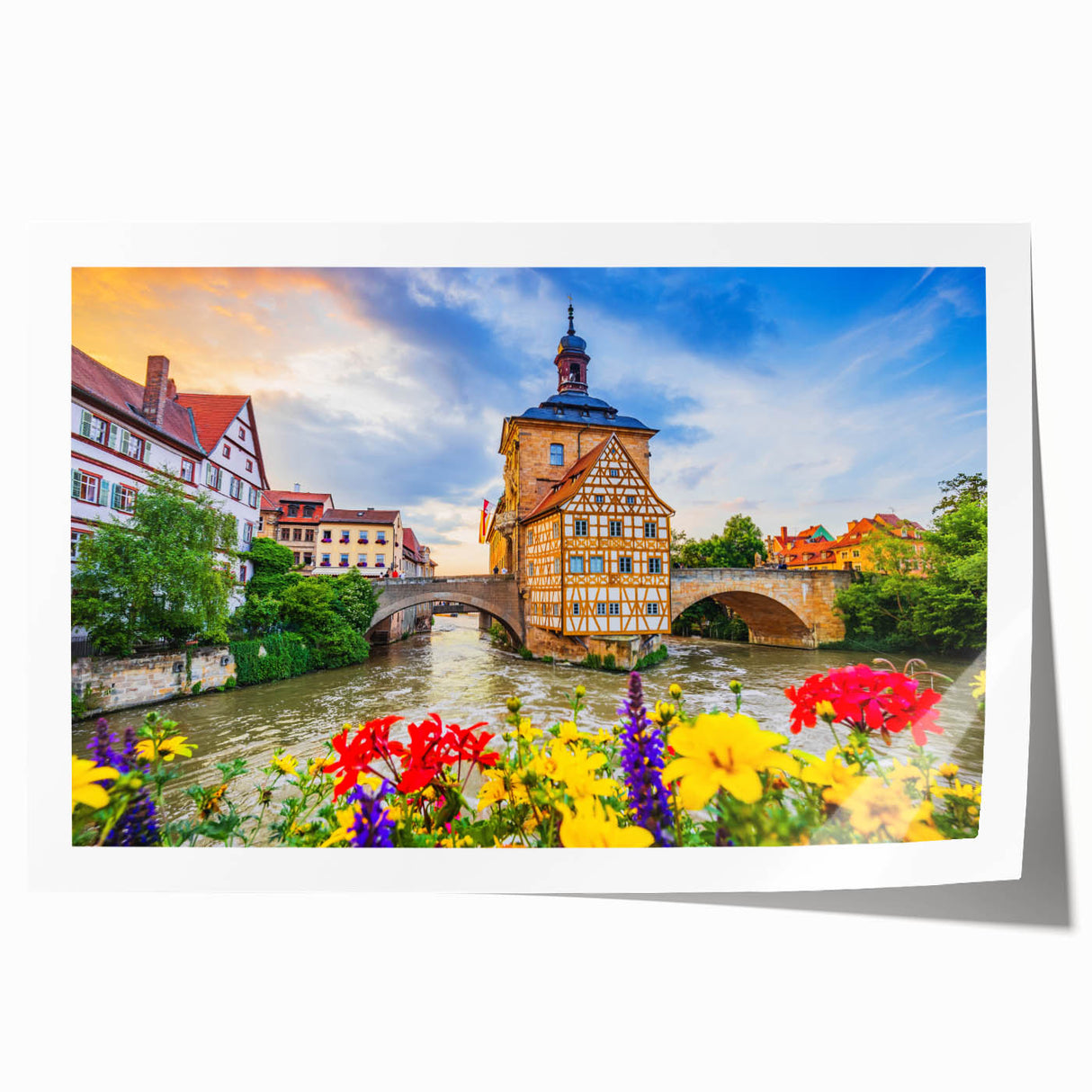 Rolled print of a Bavarian landscape with lush greenery and floral elements in soft, earthy tones.