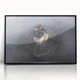 Large abstract wall art depicting a European scenery in muted earth tones, framed in black acrylic.