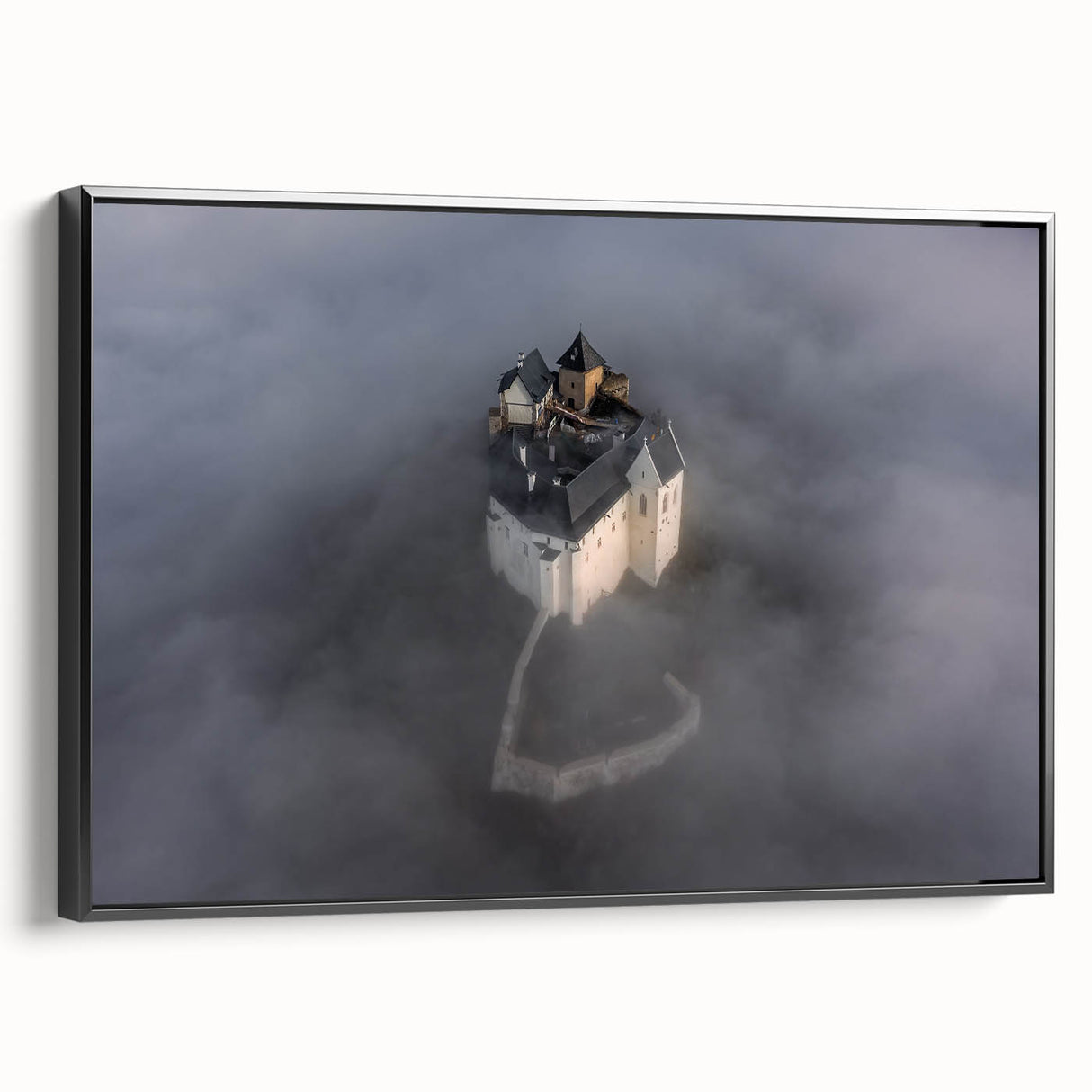 Black and white framed canvas of a European landscape, ideal for bedroom wall art.