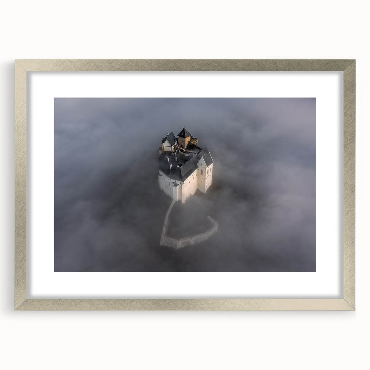 Textured abstract art print of a European scenery in muted earth tones, framed in silver, suitable for bedroom decor.