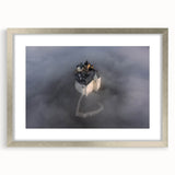 Textured abstract art print of a European scenery in muted earth tones, framed in silver, suitable for bedroom decor.