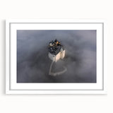 Abstract art print of a European cityscape in muted gray and blue tones, framed with a white mat.