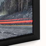 Close-up of a textured black wall art piece depicting a colorful European scenery on a framed canvas.