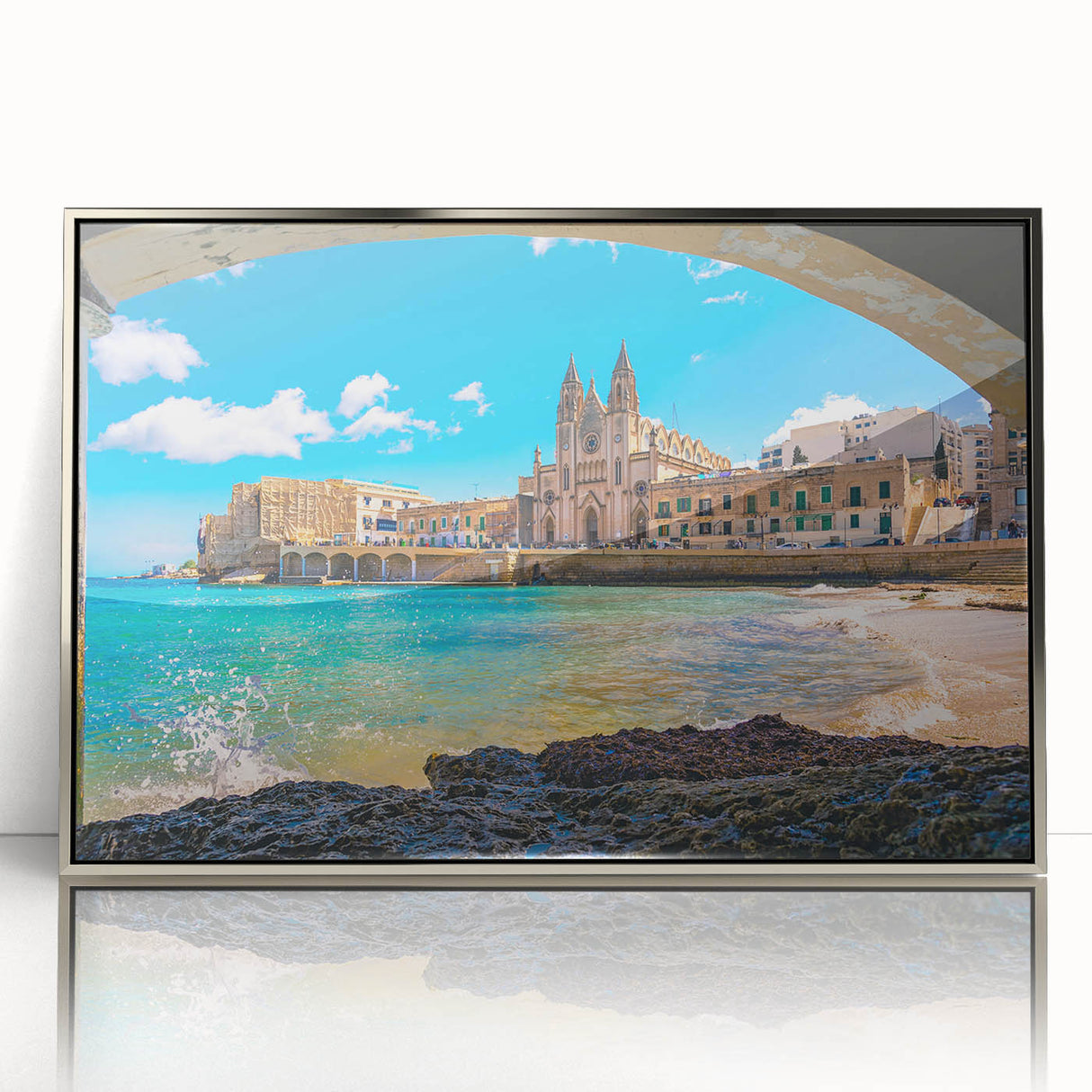 Large art print of a scenic Malta coastline in muted blue and white tones, framed in silver acrylic.