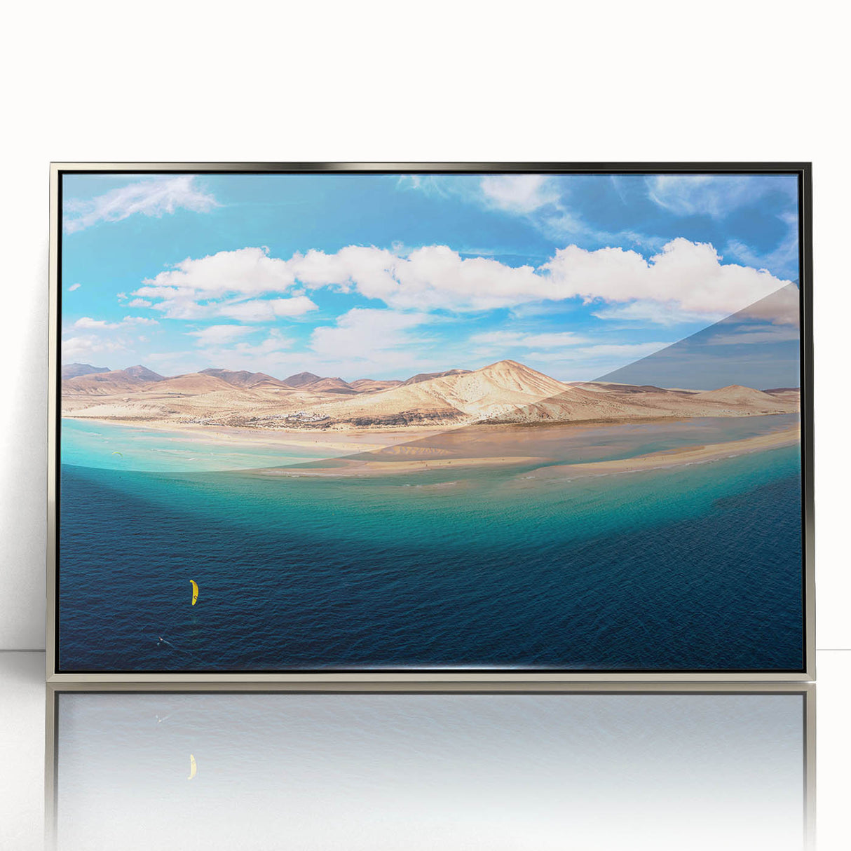 Large art print of a Canary Islands landscape in muted earth tones on a silver-framed acrylic.