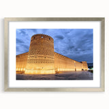 Textured abstract art print depicting a Middle Eastern scenery in muted earth tones, framed in silver, ideal for bedroom art.