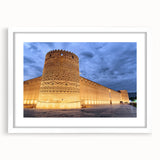 Abstract art print depicting a Middle Eastern landscape in muted earth tones on a framed white canvas.