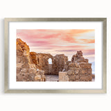 Textured abstract art print of a Middle Eastern scenery in muted earth tones, framed with a silver mat.