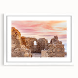Abstract art print of a Middle Eastern scenery in muted earth tones on a white framed canvas.