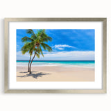 Textured abstract art print depicting an oceanic scene in muted blue and green hues, framed in silver.