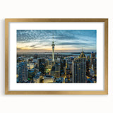 Extra large abstract art print of Auckland skyline in textured hues of blue and gray on a gold-framed canvas.