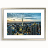 Textured abstract art print of Auckland skyline in muted gray tones on a silver-framed canvas, ideal for bedroom decor.