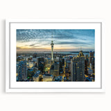 Abstract art print of Auckland skyline in muted blue tones on a white framed canvas.