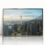 Framed acrylic print of Auckland skyline in muted gold and blue tones, suitable for modern art wall decor.