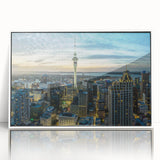 Mid-century modernist art depicting Auckland skyline in muted blue tones on a white framed acrylic.