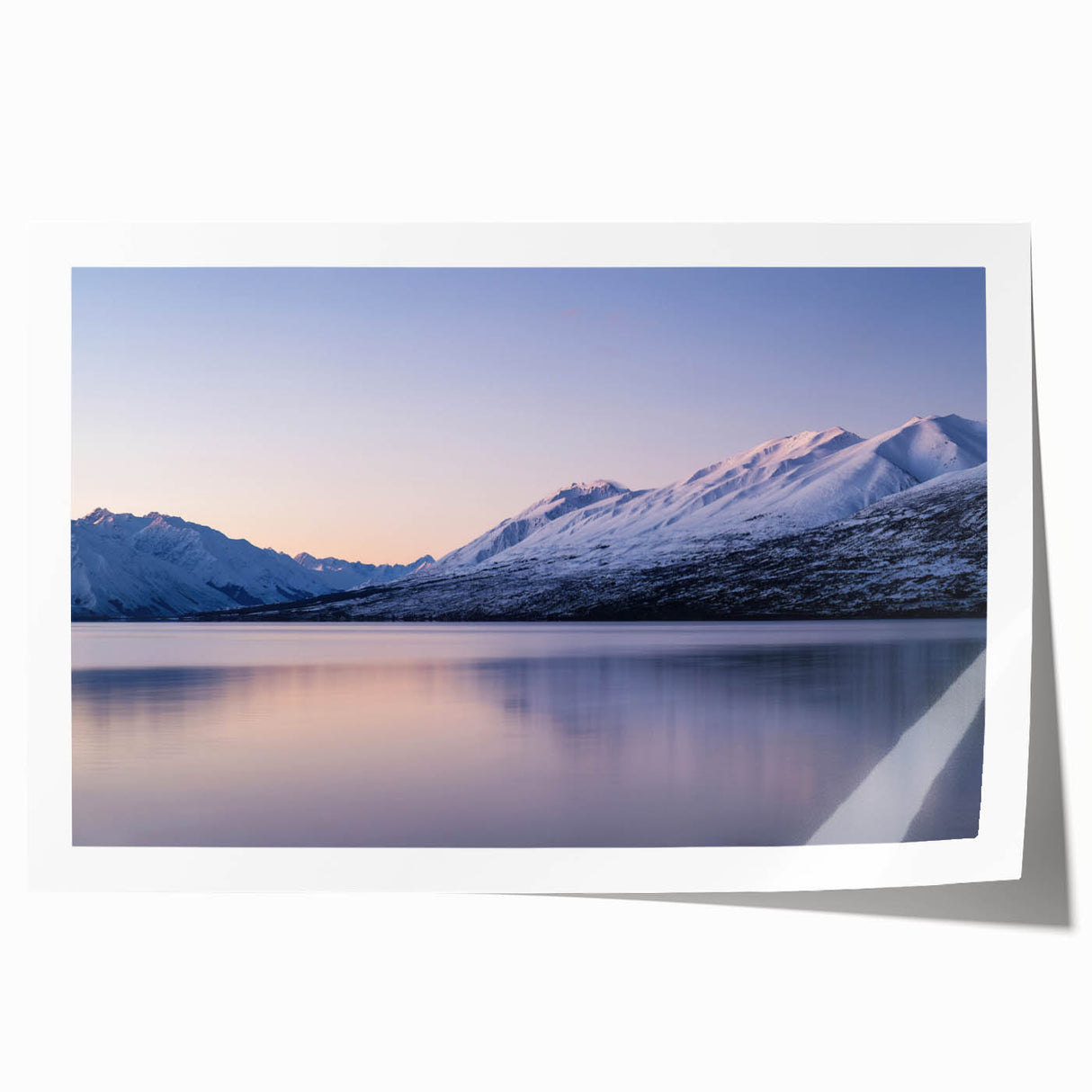Large rolled print of Canterbury, New Zealand scenery with vibrant green fields and a distant mountain range.