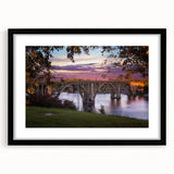Colorful abstract art print of textured scenery in Alabama, showcased in a large black frame with mat.