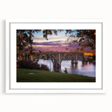 Abstract art print of Alabama scenery in muted earth tones on a white-framed mat, suitable for bedroom or dining room decor.