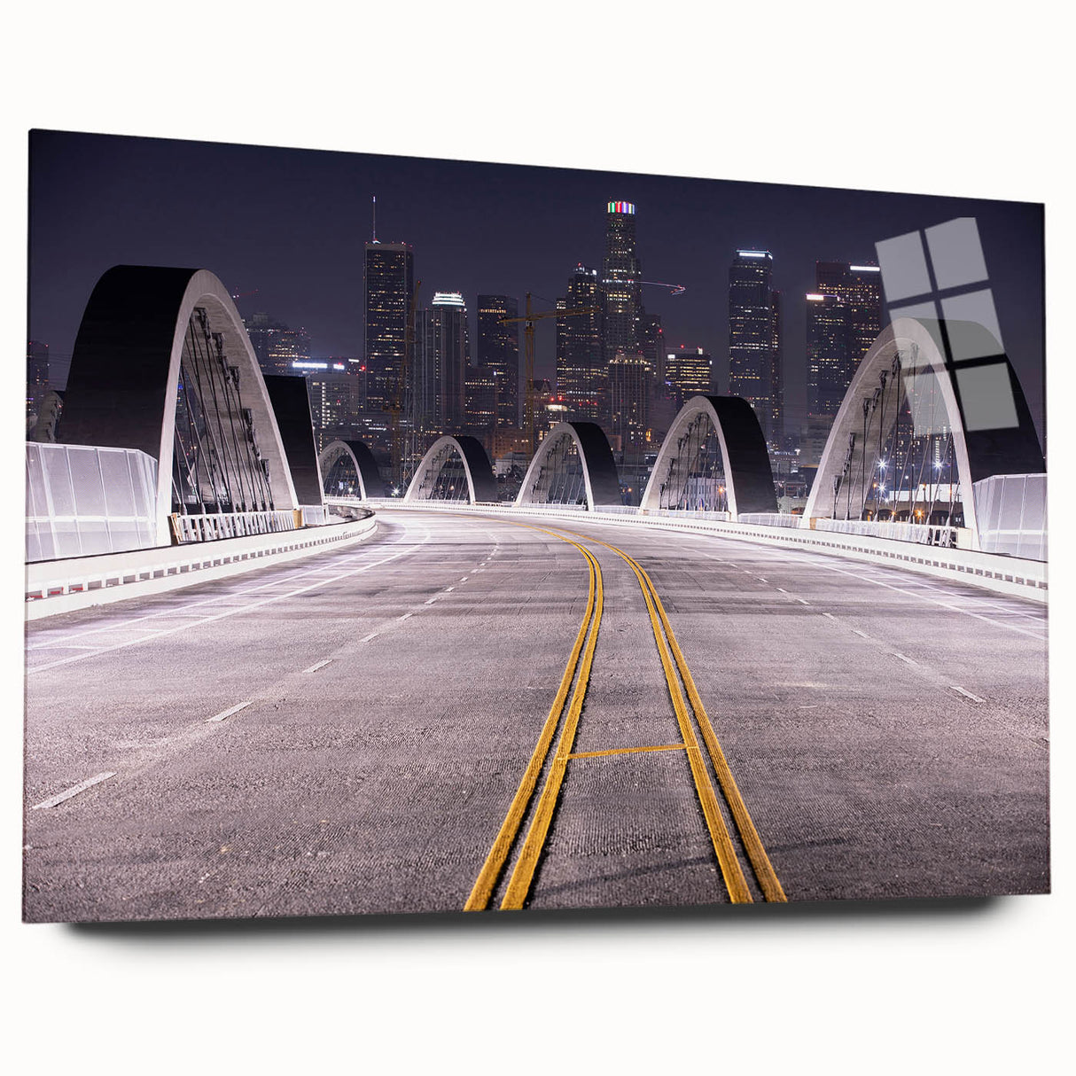Large abstract depiction of Los Angeles skyline in muted blues and greys on acrylic glass.