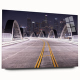 Large abstract depiction of Los Angeles skyline in muted blues and greys on acrylic glass.