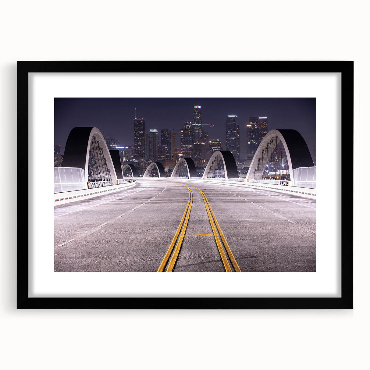 Extra large abstract art print of Los Angeles skyline in vibrant colors on a textured canvas, framed in black.