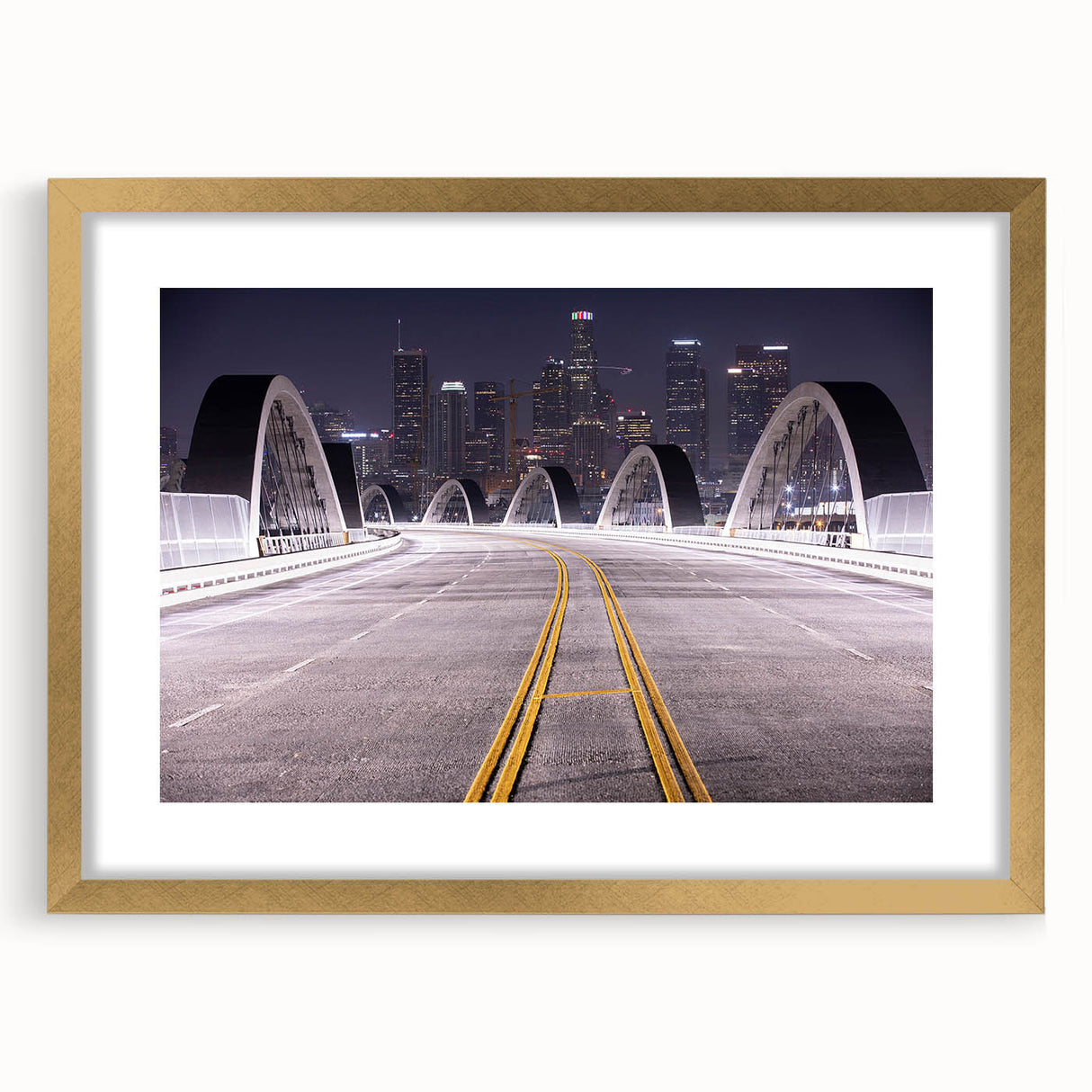 Extra large abstract art print of Los Angeles skyline in muted gold and gray tones on framed canvas.