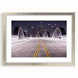 Textured abstract art print of Los Angeles skyline in muted gray and blue tones, framed in silver.