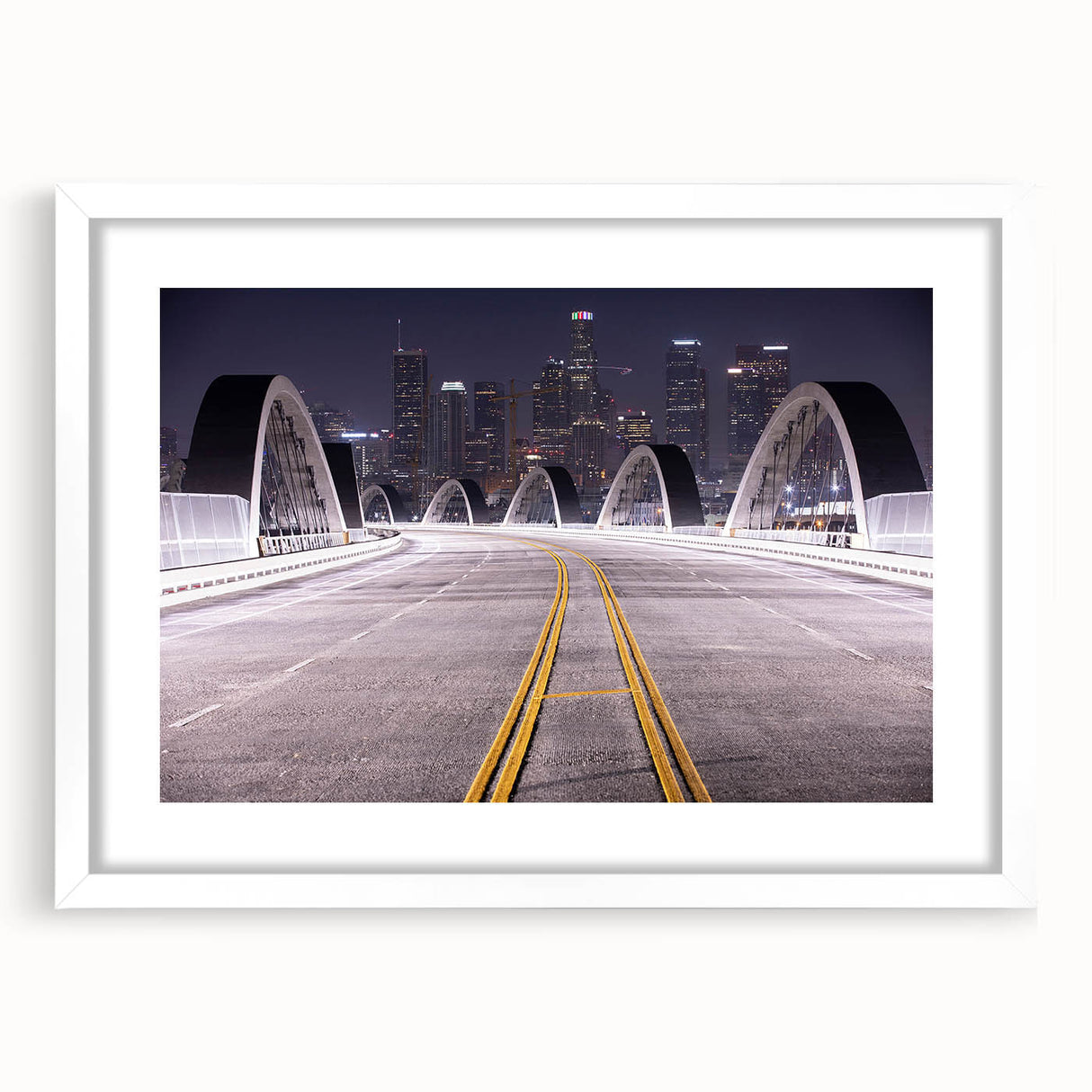 Abstract art print of Los Angeles skyline in muted gray and blue tones on a framed white mat.