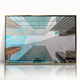 Large art print of San Francisco skyline in gold and blue tones on acrylic, framed, in mid-century modernist style.