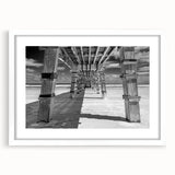 Abstract art print of Daytona scenery in muted blues and greens on a framed white canvas, ideal for dining room decor.