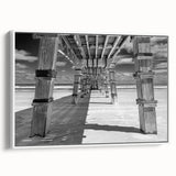 Vintage poster art of Daytona scenery on a framed canvas, featuring a palette of colorful art against a black background.