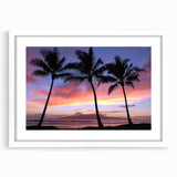 Abstract art print of a serene Maui landscape in soft blue and green tones, framed in white, ideal for dining room decor.