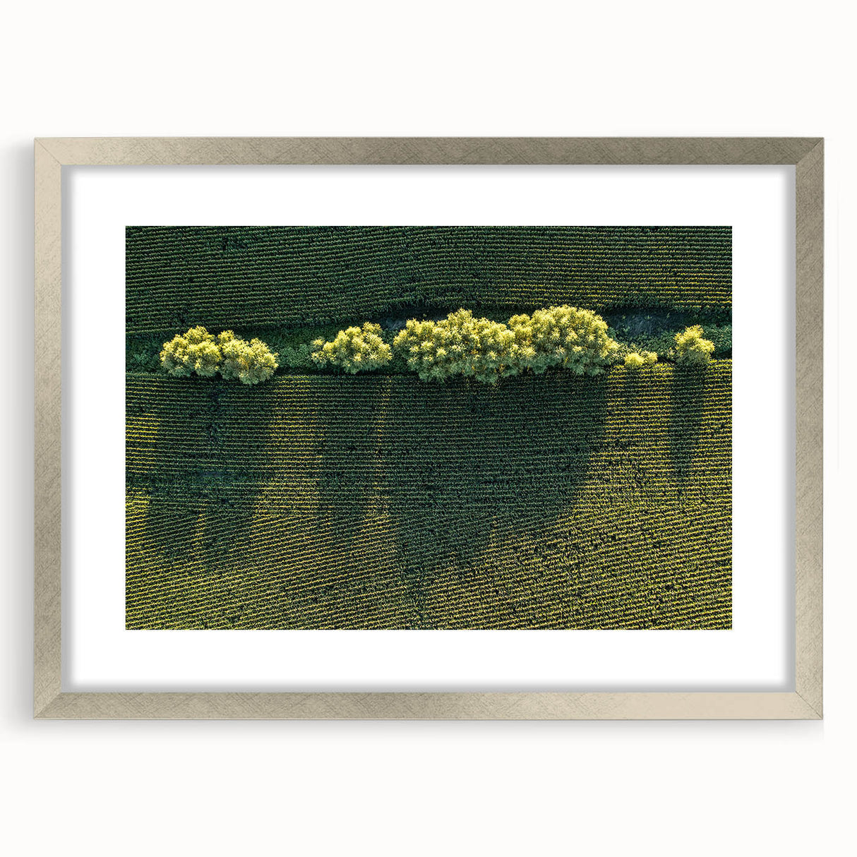 Textured art print of an abstract Iowa landscape in muted earth tones, framed in silver, ideal for bedroom decor.