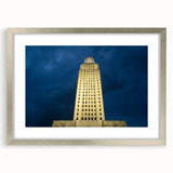 Textured abstract art print of a Louisiana landscape in muted blues and greens, framed in silver, ideal for bedroom decor.